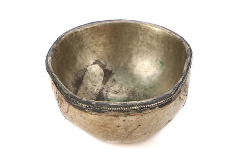 Antique Tibetan Kapala Skull Bowl, Collection of Allan: Antique Tibetan Kapala Skull Bowl. With silver overlay on rim and interior, the bowl centering a semi precious stone. Size: 2.75'' x 6.75'' x 5.2'' (7 x 17 x 13 cm). Collection of Allan Stone, New