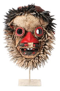 African Dan Guerre Mask, Early/Mid 20th C., Collection: African Dan Guerre Mask on Stand. Carved wood, pigment, claws, cloth. Size: 22'' x 17'' x 12'' (56 x 43 x 30 cm). Height on stand: 26" (66 cm). Collection of Allan Stone, New York. Note: There Are No