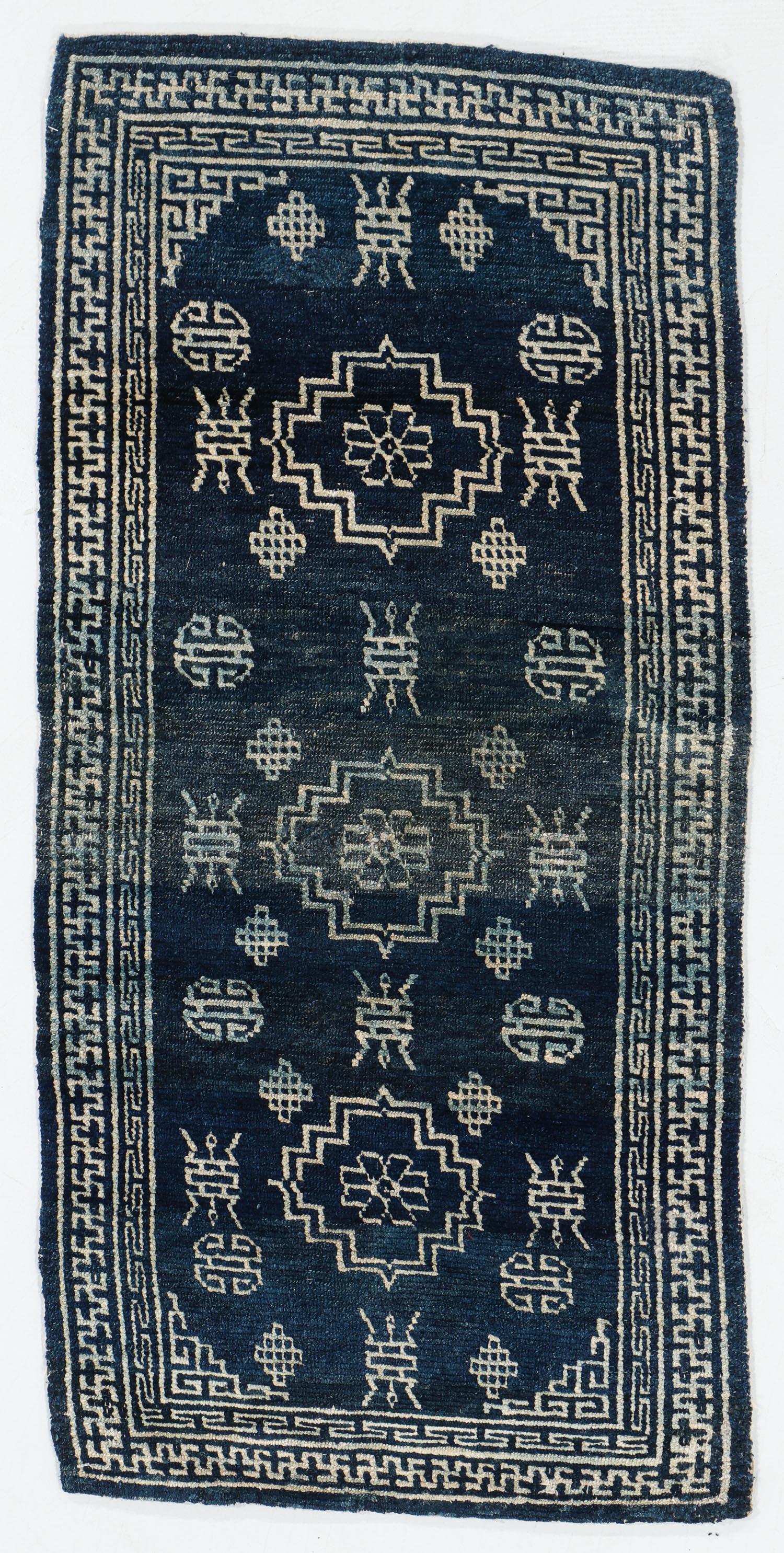 Indigo Khaden Rug, Tibet, Late 19th C., 2'3'' x 4'6'': Indigo Khaden Rug, Tibet, Late 19th C., 2'3'' x 4'6'' (69 x 137 cm). Weight: 4 lbs. Wool. Note: There Are No Hidden or Confidential Reserves in this Auction; All Acceptable Bidding Commences at the On