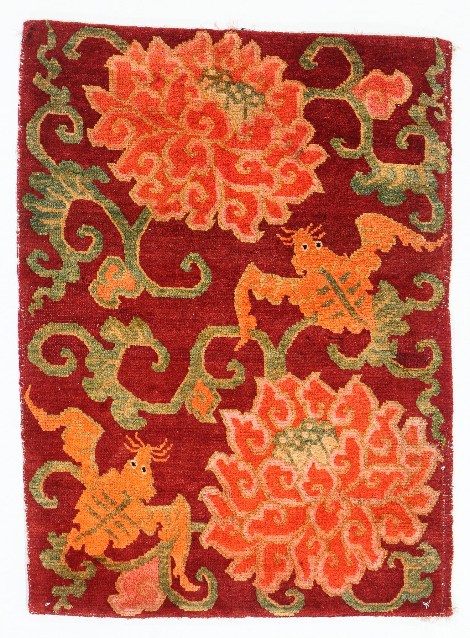 Maroon Double Bat & Flower Rug, Tibet, Early 20th C.,: Maroon Double Bat & Flower Rug, Tibet, Early 20th C., 2'1'' x 2'8'' (64 x 81 cm). Weight: 3 lbs. Note: There Are No Hidden or Confidential Reserves in this Auction; All Acceptable Bidding Commences at