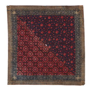 Tulis Batik Turban, Indonesia, Circa 1900: A small, handdrawn (tulis) wax resist (batik) with two different patterns in red and blue, each forming a triangle in the field, end and edge borders with a scrolling floral and vine pattern in blue a