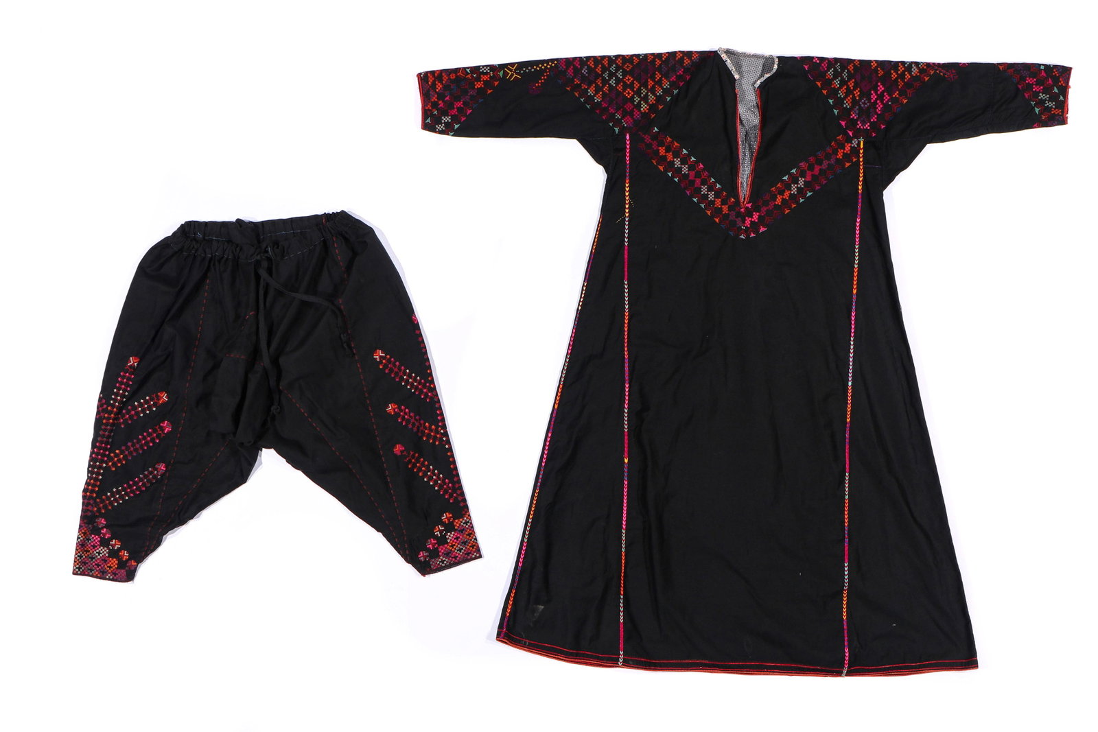 Traditional Woman's Dress and Pants, Sukhnah, Syria: Woman's dress and pants (sirwal) in cotton with silk embroidery, Sukhnah Region, Syria, early to mid 20th c. Stitches: overcast, spaced back, running, cross, and fishbone. Sizes:1) 53.5'' x 55'' (136 