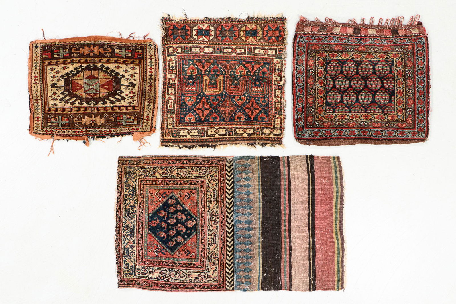 Four Antique West Persian Bags: Four Antique West Persian Bags, wool. Largest: 2'1" x 3'6". 10 lbs. Note: There Are No Hidden or Confidential Reserves in this Auction; All Acceptable Bidding Commences at the Online Start Price. Plea