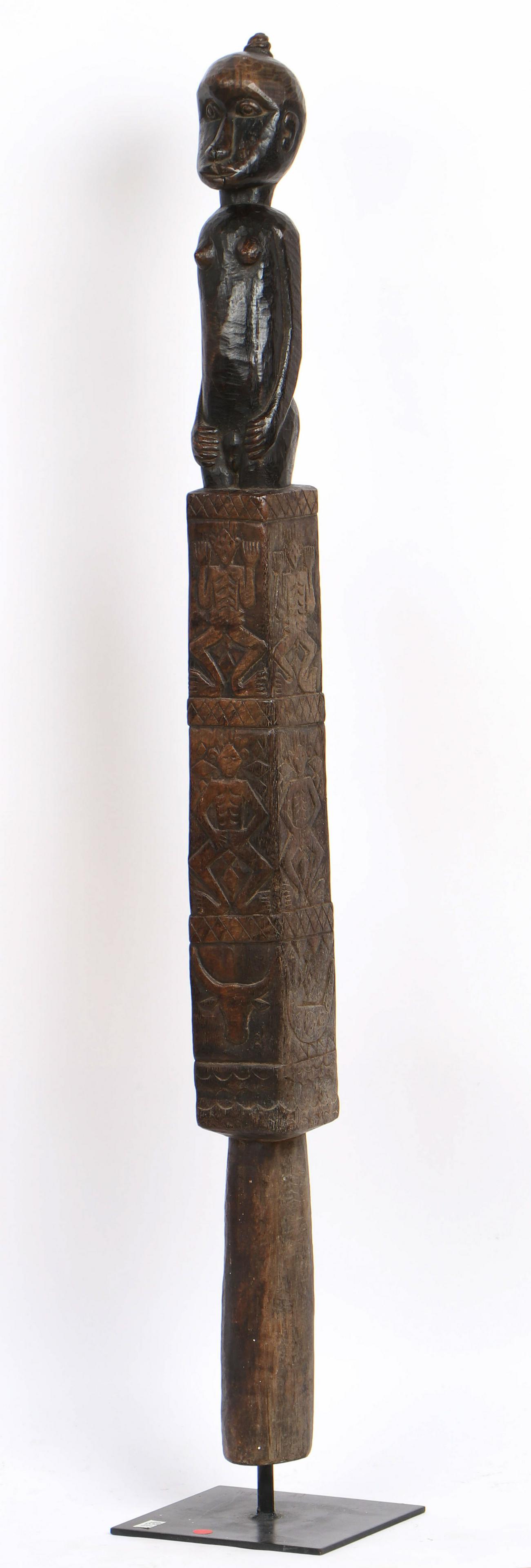 Indonesian Carved Post, Timor, Early 20th C.: Indonesian Carved Post, Timor, early 20th c. On metal stand. Provenance: Private Collection of Shirley and David Rowen, Beverly Hills, California. Size: 54'' x 3.5'' x 4'' (137 x 9 x 10 cm). Height on