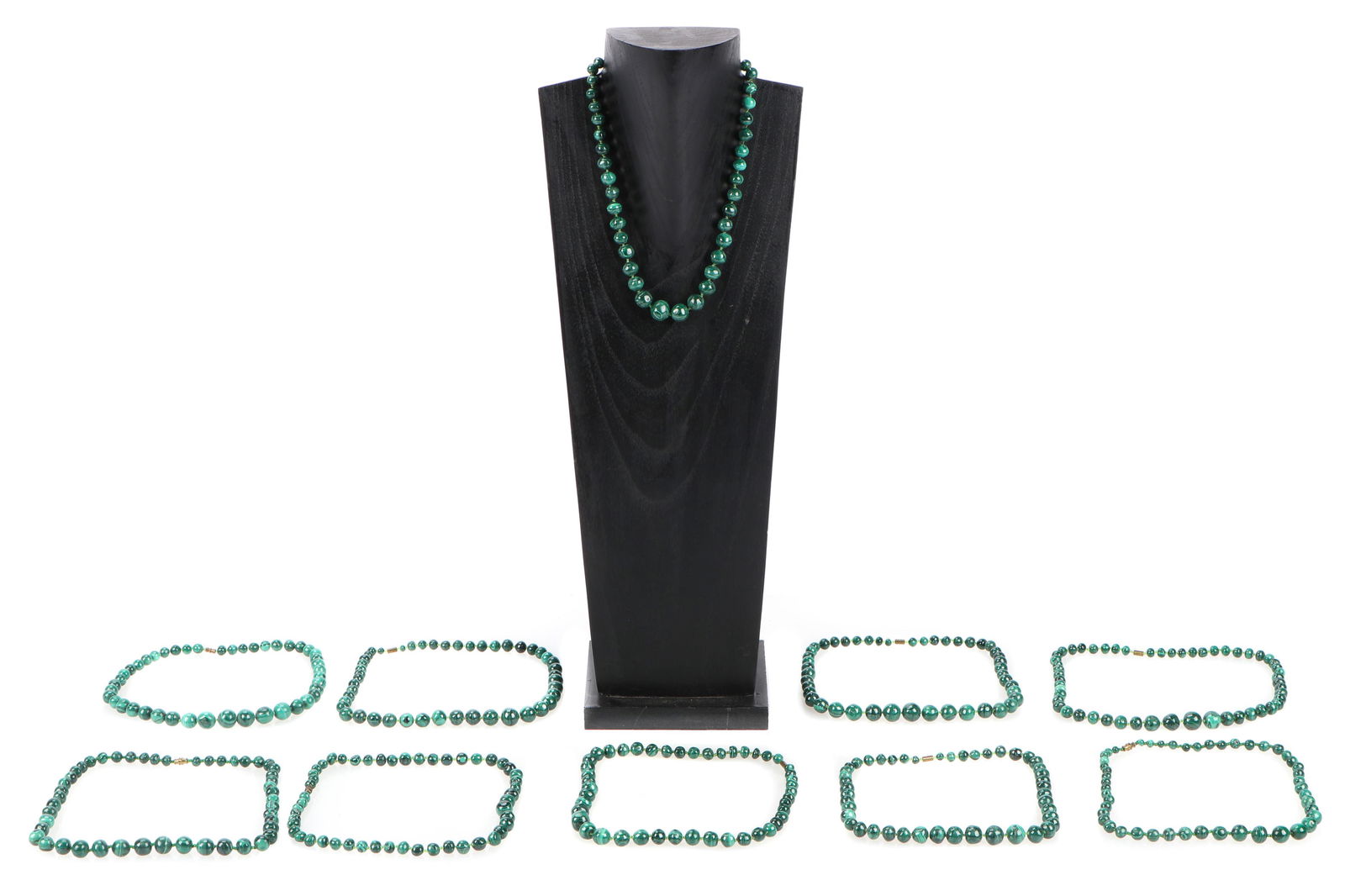 Group of 10 Malachite Bead Necklaces: Group of 10 Malachite Bead Necklaces. Stand not included. Provenance: Collection of Allan Stone, New York. Longest: 22" (56 cm). Please Note: There Are No Hidden or Confidential Reserves in this Aucti