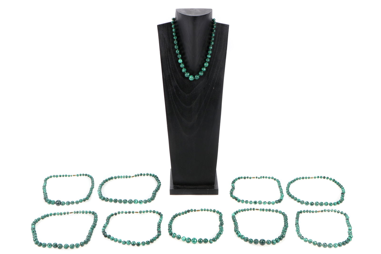 Group of 10 Malachite Bead Necklaces: Group of 10 Malachite Bead Necklaces. Stand not included. Provenance: Collection of Allan Stone, New York. Longest: 22.5" (57 cm). Please Note: There Are No Hidden or Confidential Reserves in this Auc