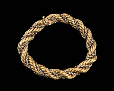 Heavy Italian 18kt Yellow & White Gold Rope Bracelet: Heavy 18kt yellow and white gold rope bracelet stamped 18k Italy. Weight 45.12 g. Total Length: 8" (20 cm). Provenance: Estate of Aviva and Jack Robinson, Bloomfield Hills, Michigan.