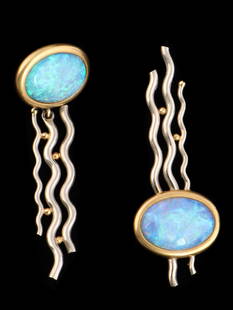 Handcrafted 18k Yellow and White Gold Opal Earrings: Handcrafted 18k yellow and white gold opal earrings marked 18k with designer marking, meant to be worn with one opal at top and the other at bottom, the dangles attached to the opal worn at top of