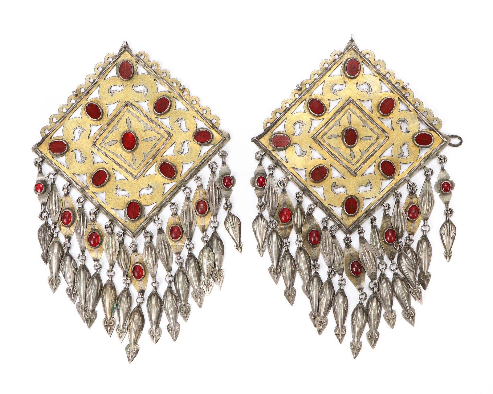 Pair of Antique Turkmen Silver Gilt Pendants: Pair of Antique Turkmen Silver Parcel-Gilt Pendants. Openwork silver with fire gilding, carnelian and glass decoration; each with dangling pendants. The hexagon, rhombus, and triangle are the most com