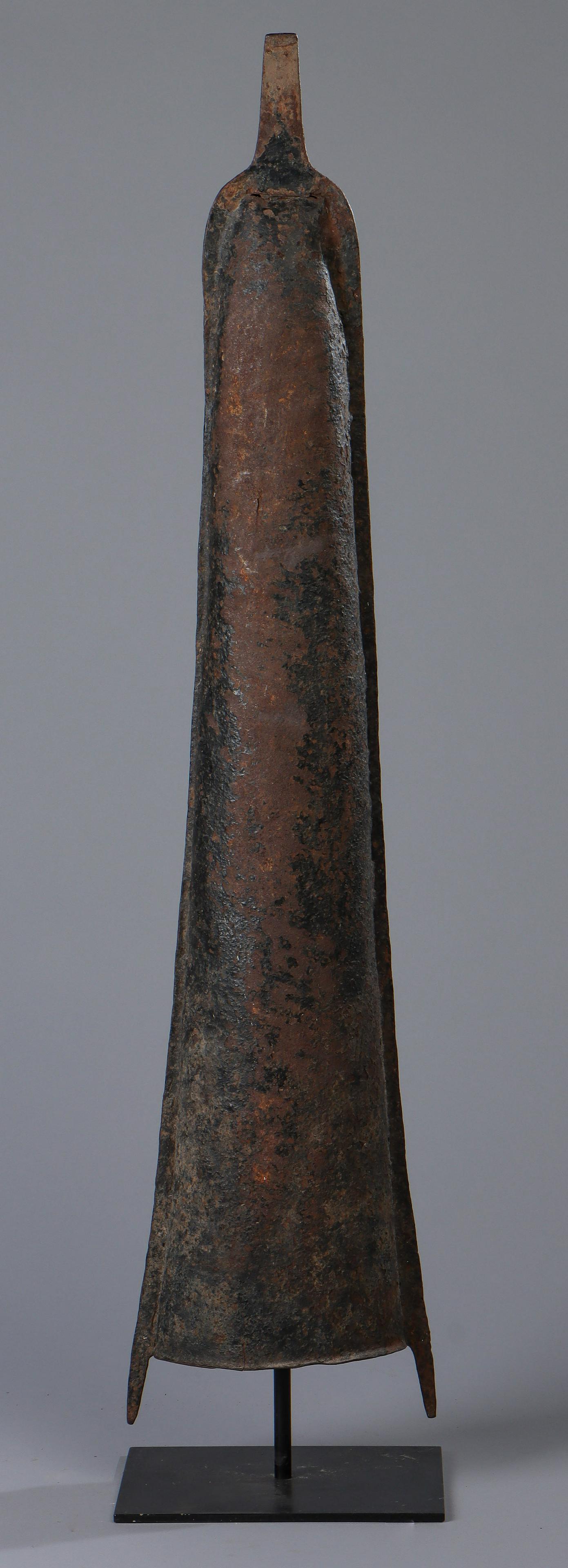 Massive Antique African Yoruba Currency Gong, Nigeria: Massive Antique African Yoruba Currency Gong, Nigeria. On stand. Size: 41'' x 9.5'' x 5'' (104 x 24 x 13 cm); Height on Stand: 42" (107 cm). Ex. Cathryn Cootner Estate Collection, Sonoma, CA.