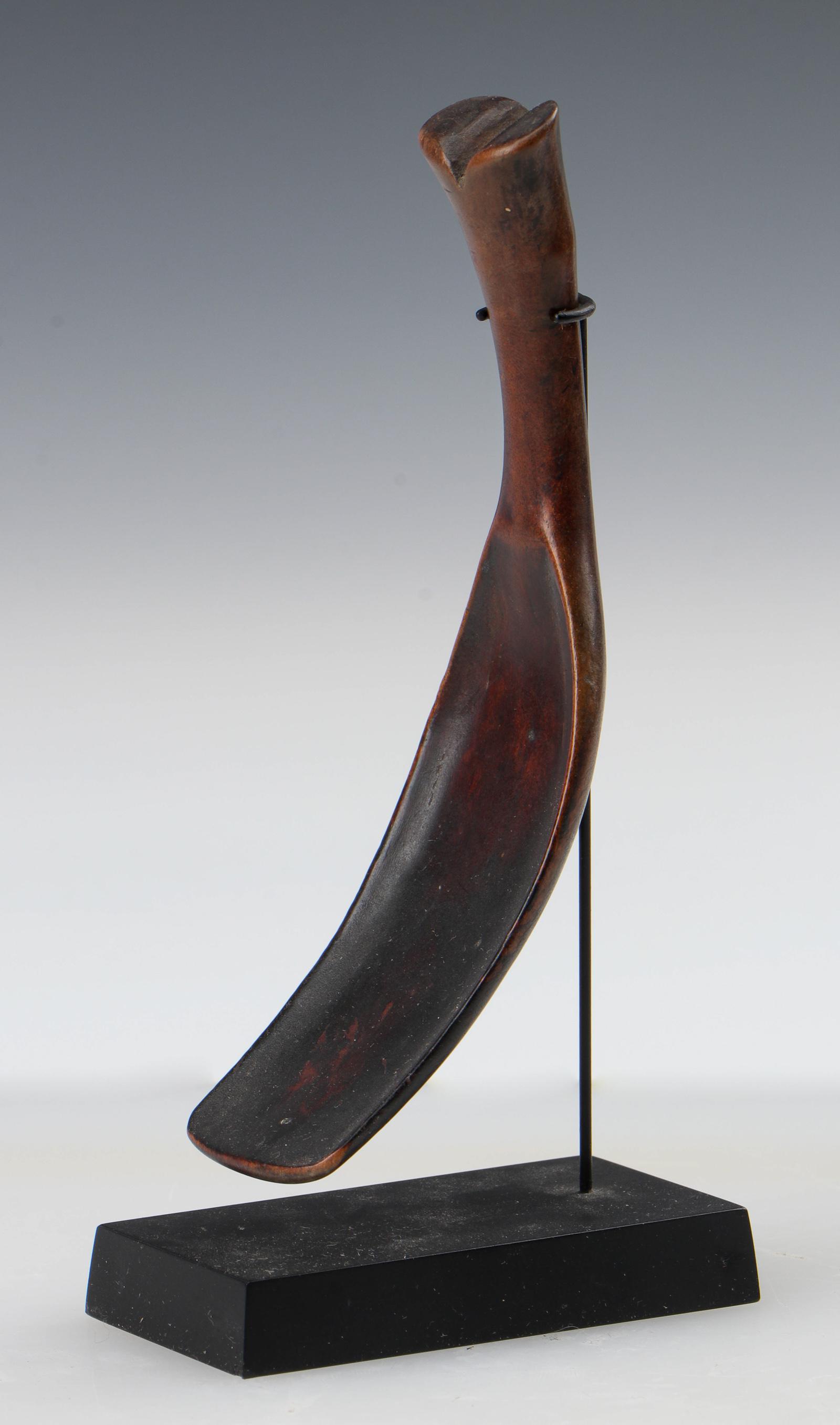 Antique Toraja Spoon, Sulawesi: Antique Toraja Spoon, Sulawesi. Carved wood. On stand. Size: 5.5'' x 1.25'' (14 x 3 cm); Height on stand: 6" (15 cm). For a similar example, see The Metropolitan Museum, New York: https://www.metmuseu