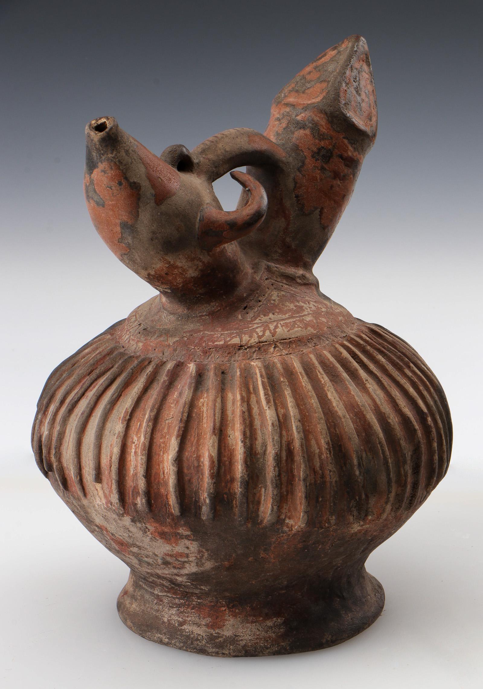 Antique Indonesian Water Vessel Kendi, Lampung, Sumatra: Antique Indonesian Water Vessel Kendi, Lampung, Sumatra. Double-spouted unglazed terracotta vessel used to hold drinking water â€“ the unglazed nature of the vessel allowed it to be semi-porous s