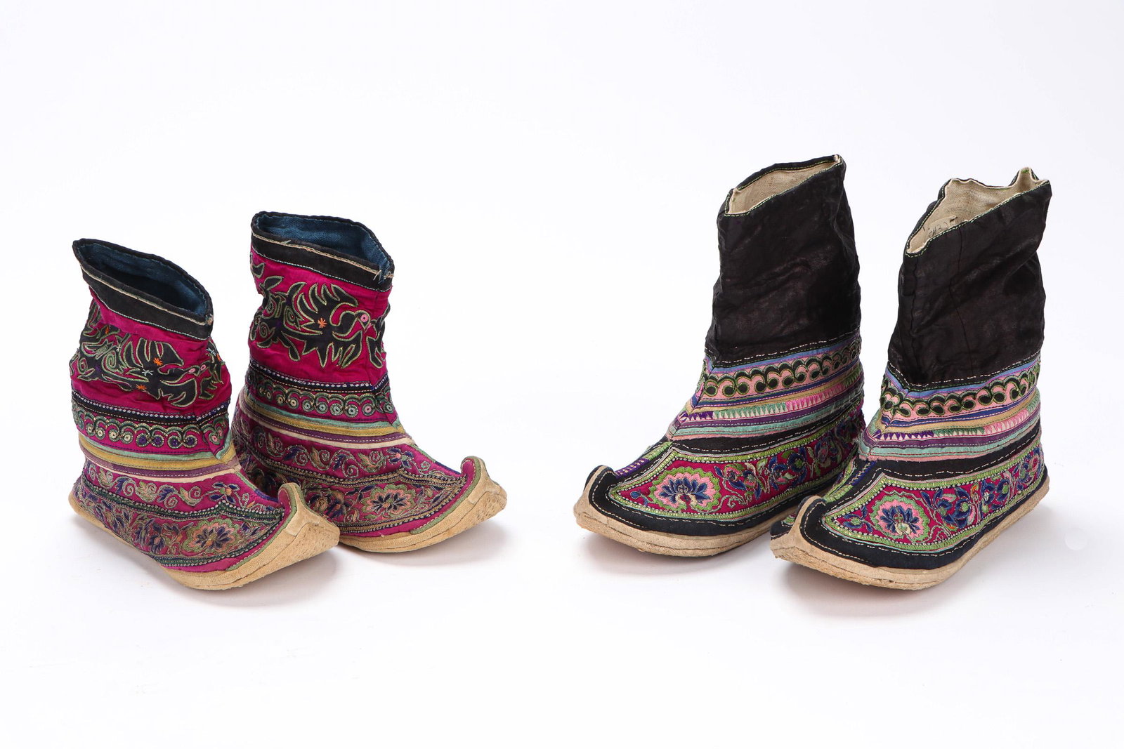 2 Pair of Zhuang Boots, China, Early-Mid 20th C.: 2 Pair of Zhuang Boots, China, Early-Mid 20th C. Two pair of curly toed shoes with embroidered satin uppers, cotton cloth covered fiber base, decorated with cotton applique on satin and couched foil e
