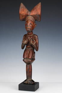 Fine 19th C. African Yoruba Shango Dance Wand, Nigeria: Fine 19th C. African Yoruba Shango Wand, Nigeria. Carved wood. On stand. Among the objects used to honor the Yoruba god of thunder, Shango, is the oshe Shango, or dance wand. It is carried by Shango p