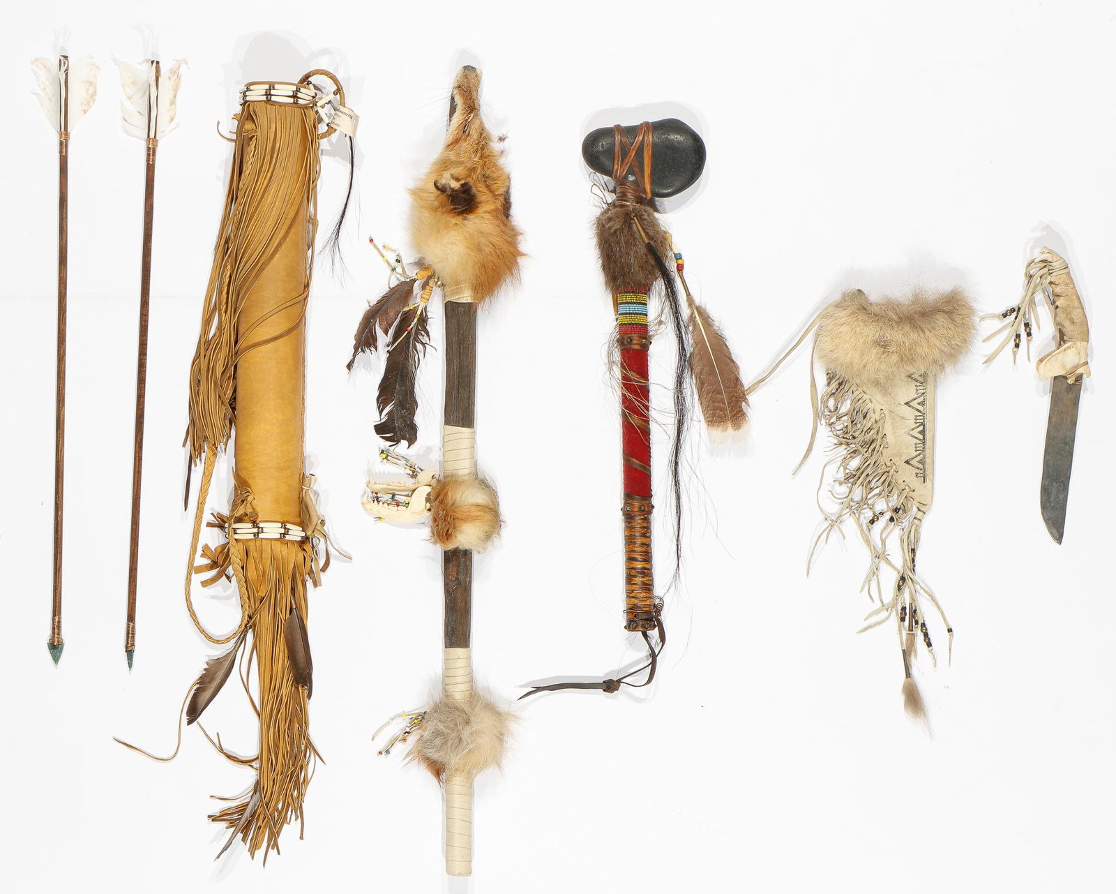 Collection of Contemporary Native American Objects: Collection of Contemporary Native American Objects.Deer hide, stone, beads and cones, bone, beaver fur, trade cloth, horse hair, turkey feather. Including a coyote jaw knife with sheath, medicine stic