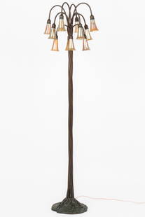 Tiffany Style Bronze 12-Light Lily Floor Lamp, Early 20th C.: Tiffany Style Bronze 12-Light Lily Floor Lamp, Early 20th C. Heavy bronze tall 12-stem standard with 11 Favrile glass style iridescent gold shades with delicately ruffled rims. Bottom of base marked: