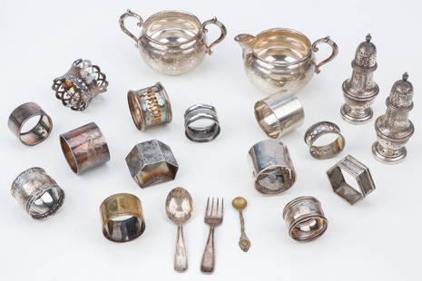 Sterling Silver Lot: Sterling Silver Lot. Including a Gorham sugar and creamer, miscellaneous napkin rings, casters and baby fork and spoon. Together with unmarked napkin rings. Sizes ranging from: 2'' (5 cm) to: 4.5''