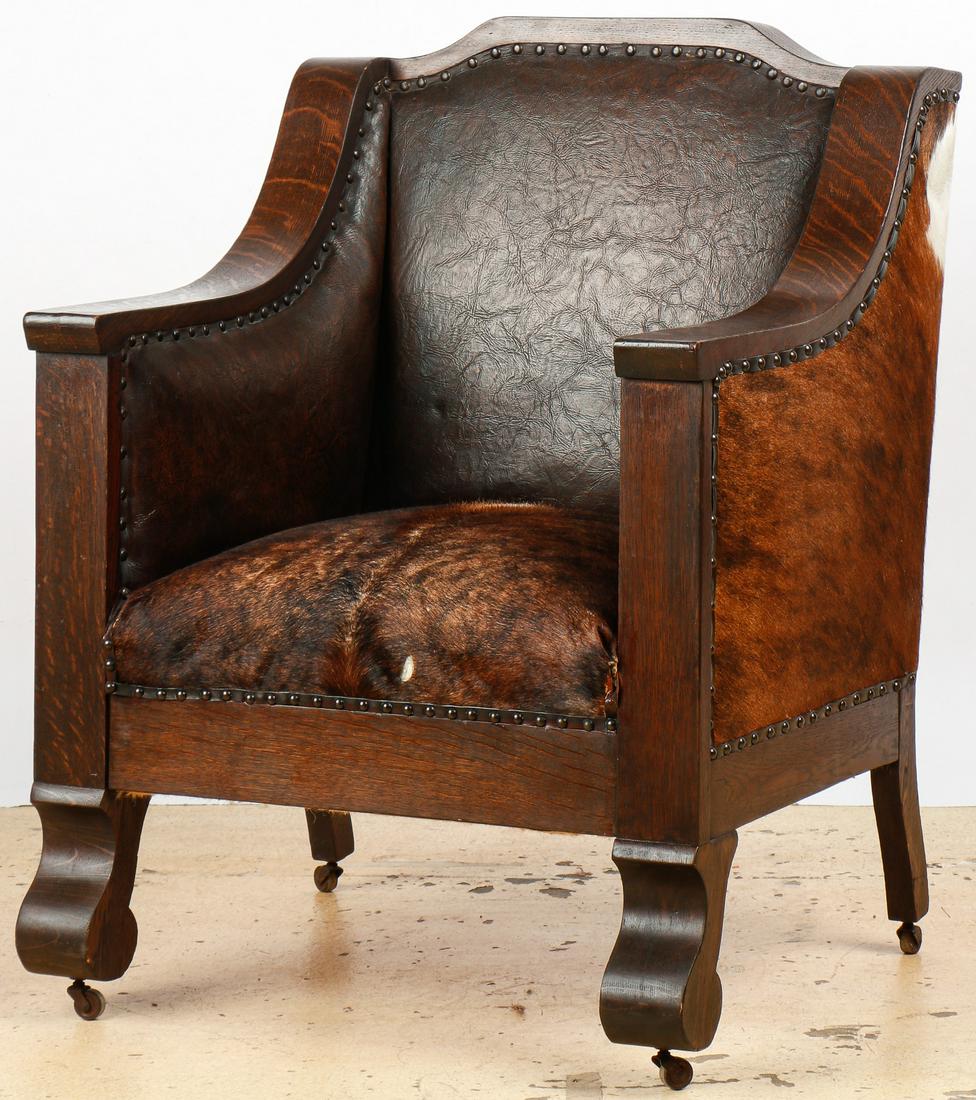 Empire Style Oak and Cowhide Throne Chair, 19th C.: Empire Style Oak and Cowhide Throne Chair, 19th C. Re-invented in new cowhide seat, sides and back, professionally refinished, re-tied springs, new tacks and trim, sides built out with new foam and da