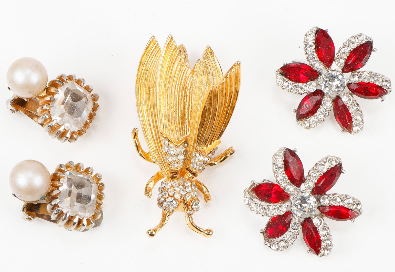 Vintage Hattie Carnegie Jewelry, C. 1960s: Vintage Hattie Carnegie Jewelry, C. 1960s. Including 3 brooches and a pair of earrings. Ex. Estate Collection Isadore and Nancy Marder, Philadelphia. Size: Ranging from .75'' x .5'', (2 x 1 cm) to 2''