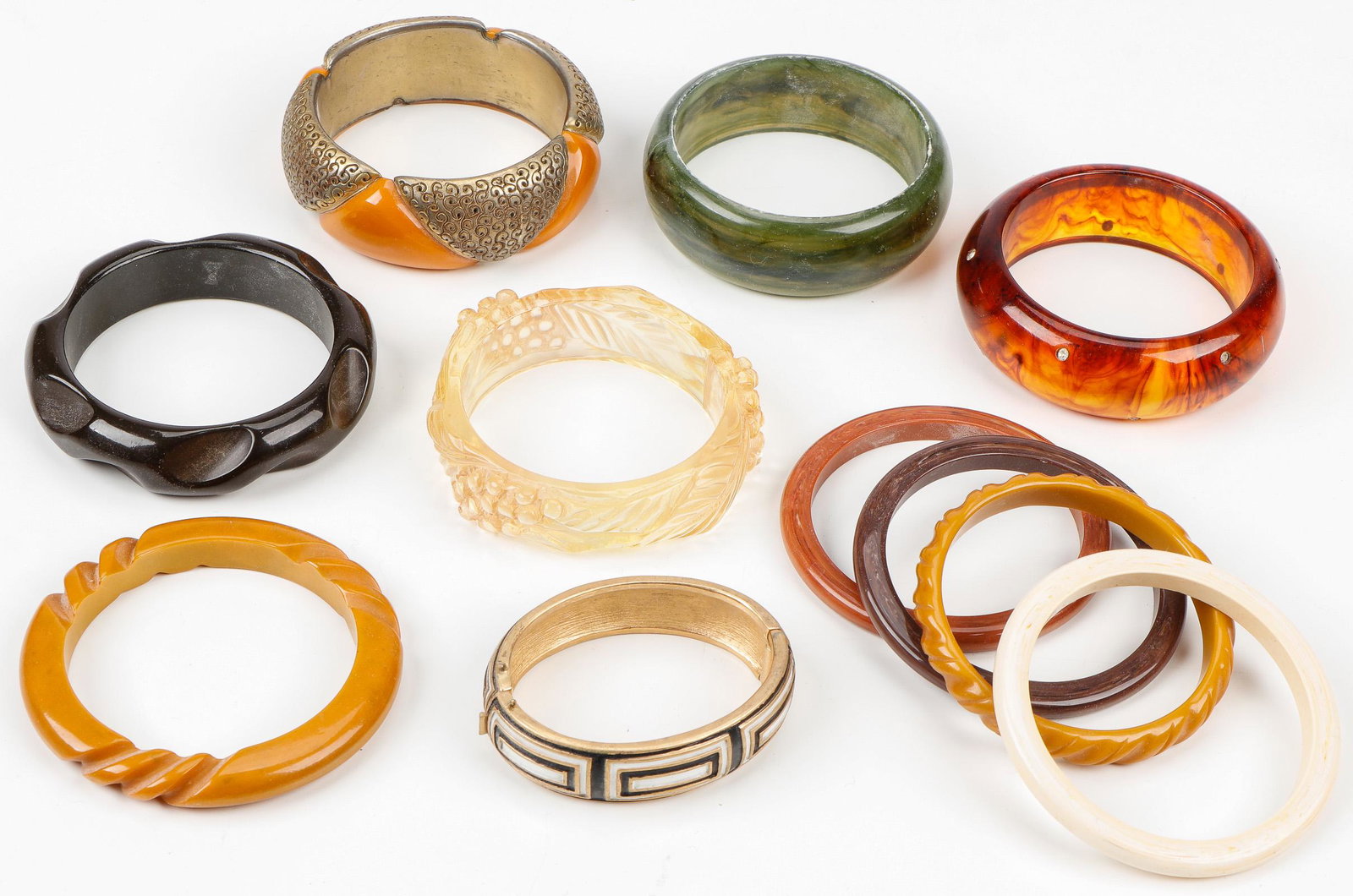 Lot of Vintage Bracelets Including Bakelite, C. 1960s-70s: Lot of Vintage Bracelets Including Bakelite, c. 1960s-70s. Ex. Estate Collection Isadore and Nancy Marder, Philadelphia. Size: Ranging from 3.25'' x 3.25'' x .75'' (8 x 8 x 2 cm) to 3.25'' x 3.25'' x 