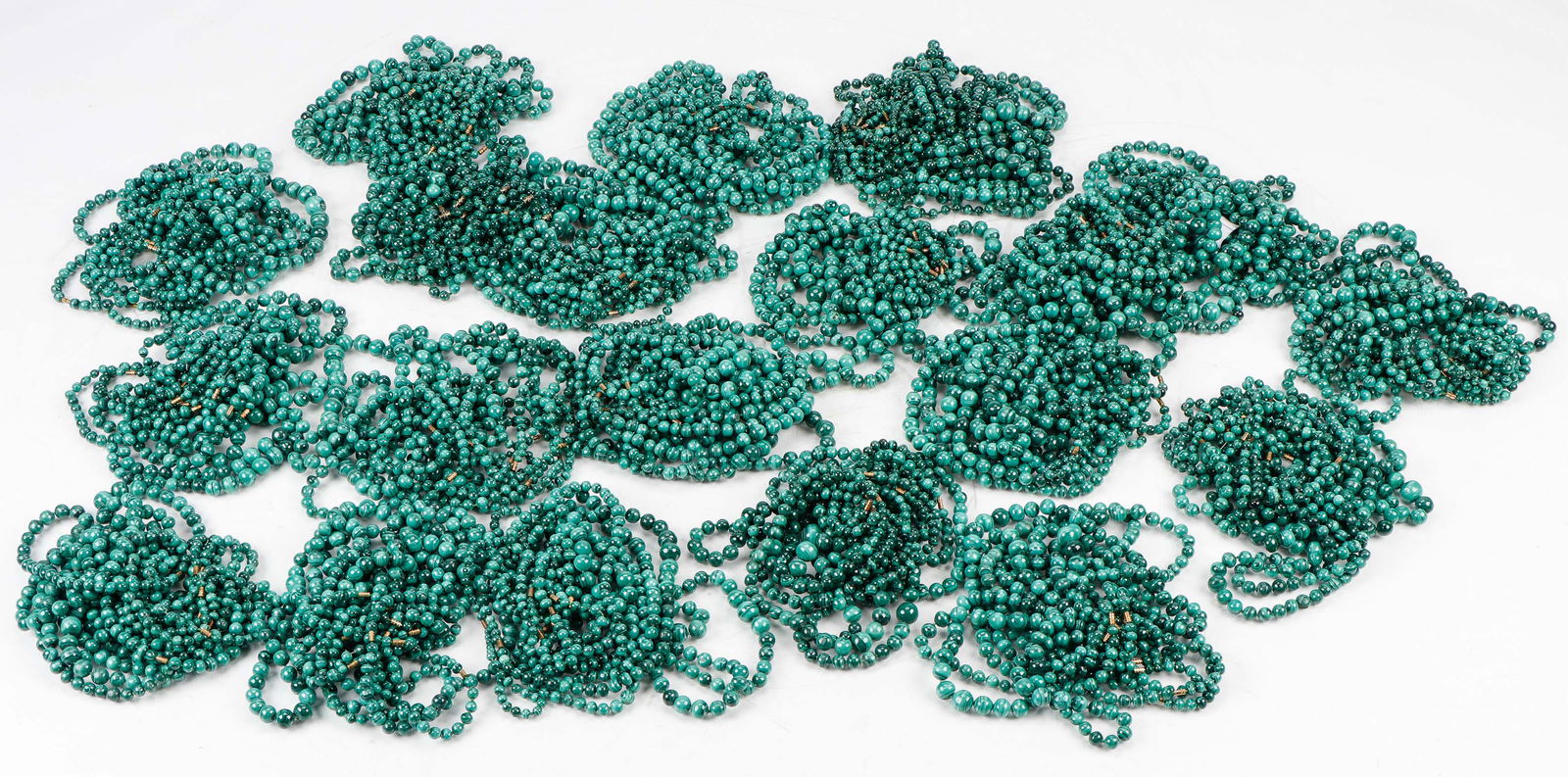 Huge Collection of 200 Malachite Bead Necklaces: Huge Collection of Malachite Bead Necklaces. 200 strands. Provenance: Collection of Allan Stone, New York. Longest: 23" (58 cm).