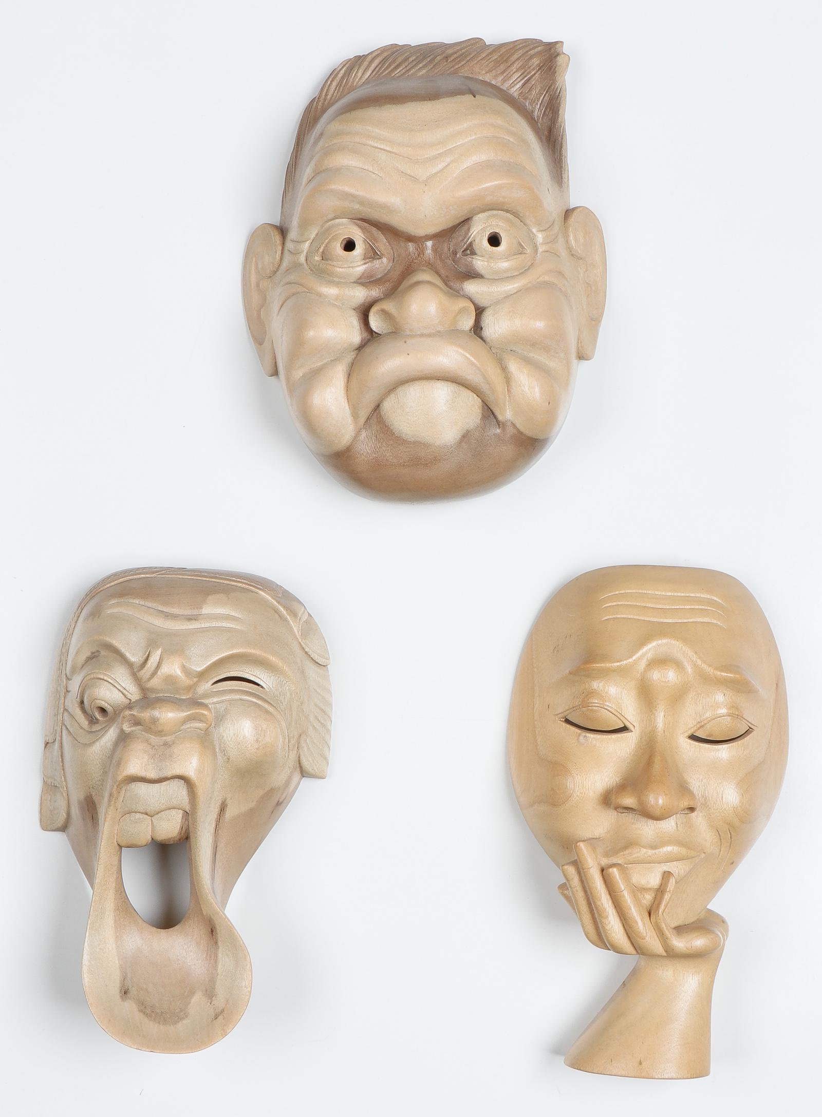 3 Balinese Carved Wood Masks by Nyoman Naranata: 3 Balinese Carved Wood Masks by Nyoman Naranata. Signed. Sizes ranging from 9'' x 8'' x 3'' (23 x 20 x 8 cm) to 10'' x 5.75'' x 3'' (25 x 15 x 8 cm). Property from the Jim and Kit Horne Collection.