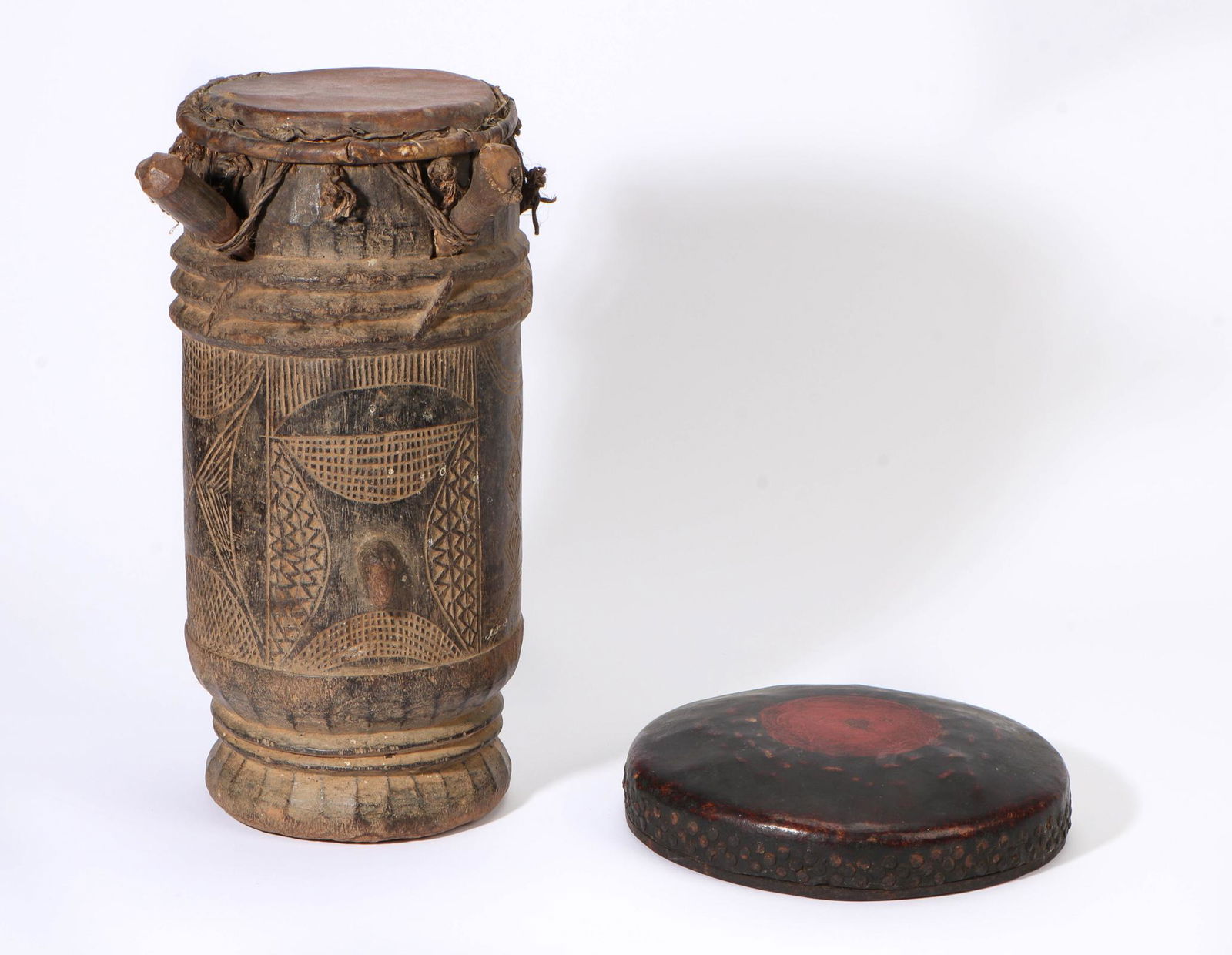Antique West African Drum and Chinese Instrument: West African Antique Drum and Chinese Percussion Musical Instrument. 19th - Early 20th C. Sizes: 1) 10'' x 10'' x 2.25'' (25 x 25 x 6 cm); 2) 16.25'' x 12'' x 9.5'' (41 x 30 x 24 cm).