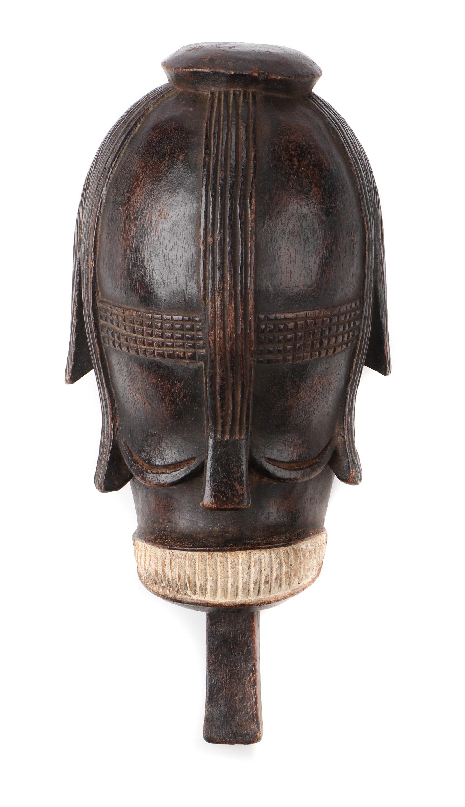 West African Mask, Nigeria: West African Mask, Nigeria. Carved wood and pigment. Size: 17'' x 8'' x 6'' (43 x 20 x 15 cm).