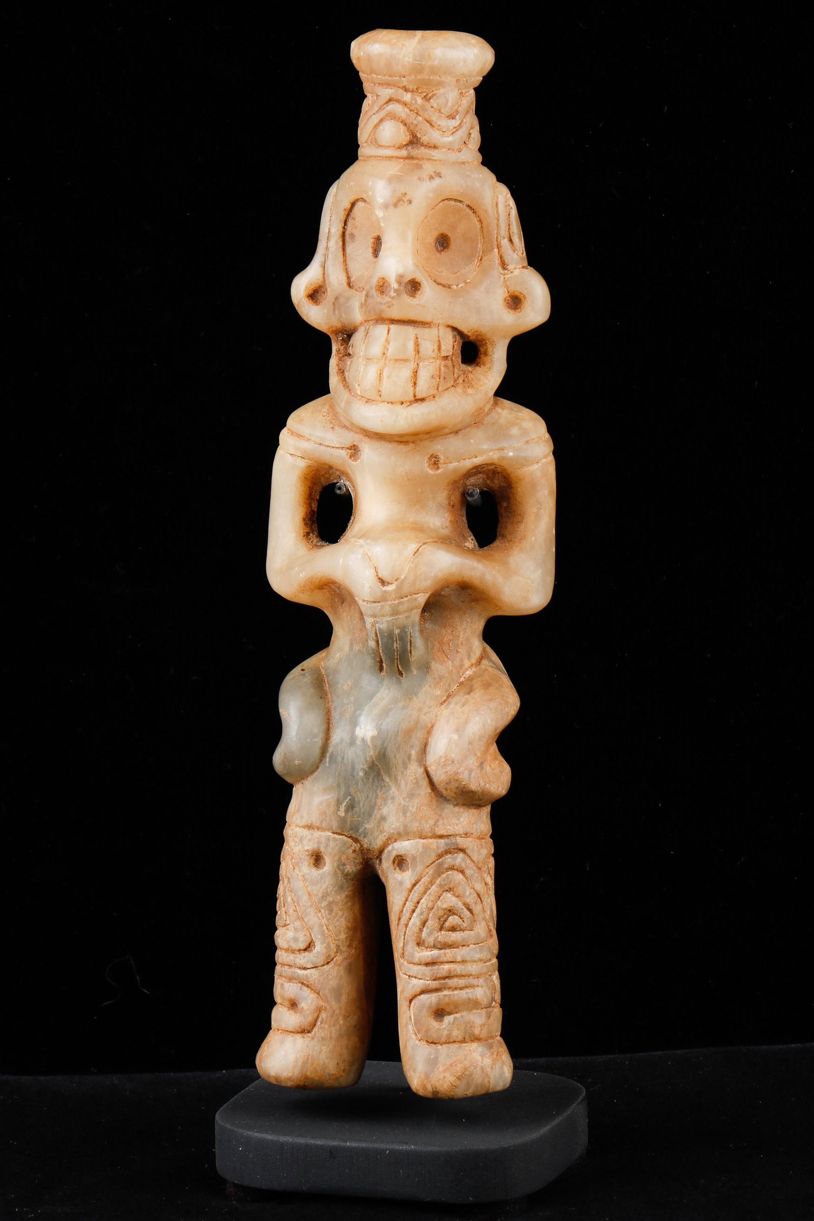 Taino Large Standing Anthropic Cohoba Inhaler: Taino Large Standing Anthropic Cohoba Inhaler. For the snuffing of the powdered hallucinogen. Strong skeletal facial features. Pierced at jaw line and wrists. Arms combine with hands to form "spirit f