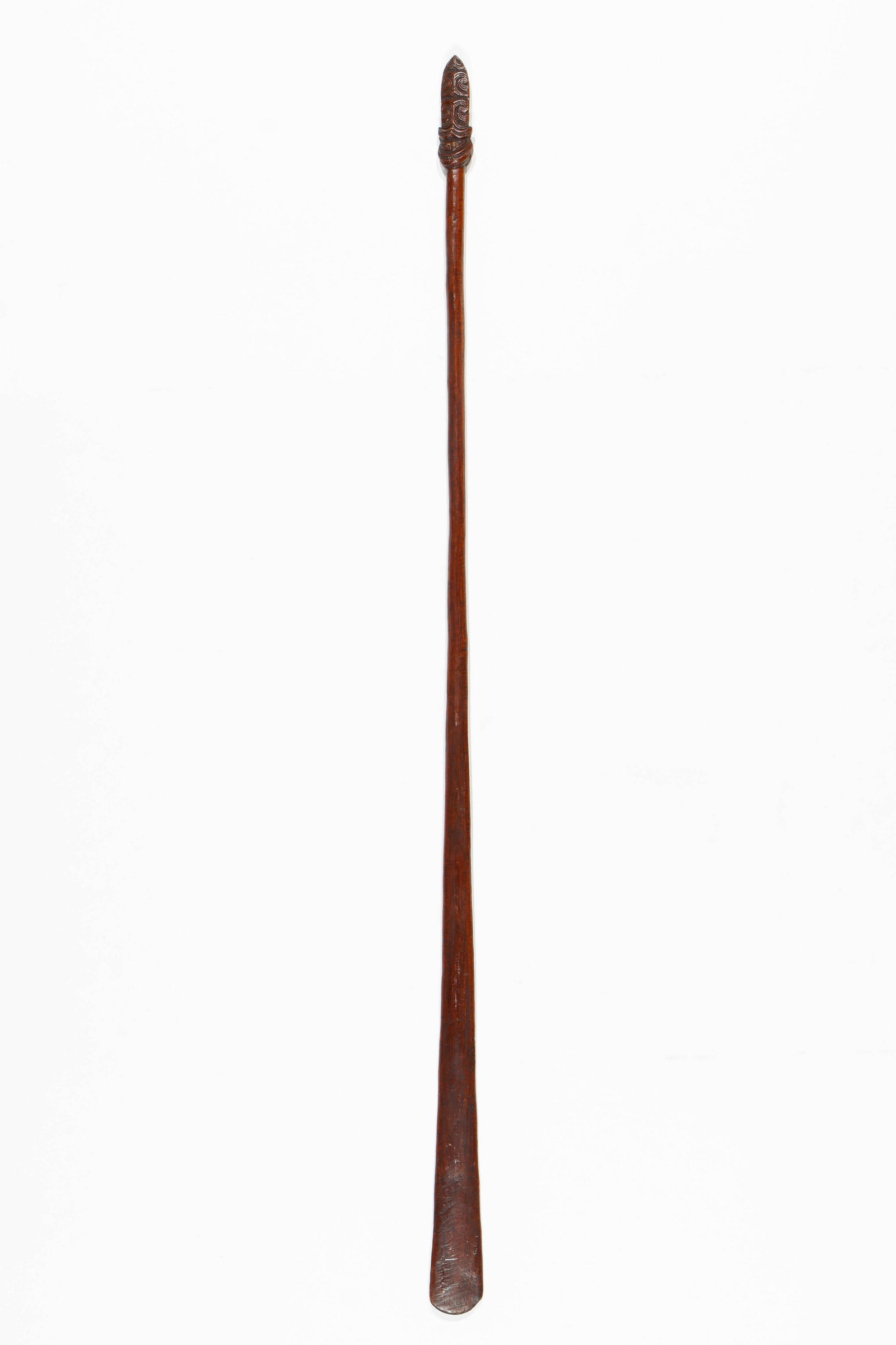 Fine Antique Maori Taiaha, 55": Fine Antique Maori Taiaha. The carved hardwood weapon with the long flat blade body, head and tongue used for stabbing and parrying. Size: 55'' x 2.5'' x 1'' (140 x 6 x 3 cm).