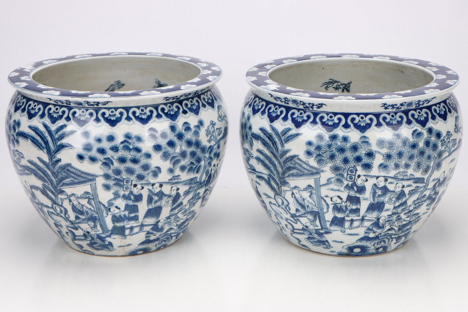 Pair of Chinese Porcelain Blue & White Fish Bowls: Pair of Chinese Porcelain Blue & White Fish Bowls. Size: Each 12'' x 14.5'' x 14.5'' (30 x 37 x 37 cm). Provenance: Sylvia and Philip Chaplain Collection, New Hampshire.