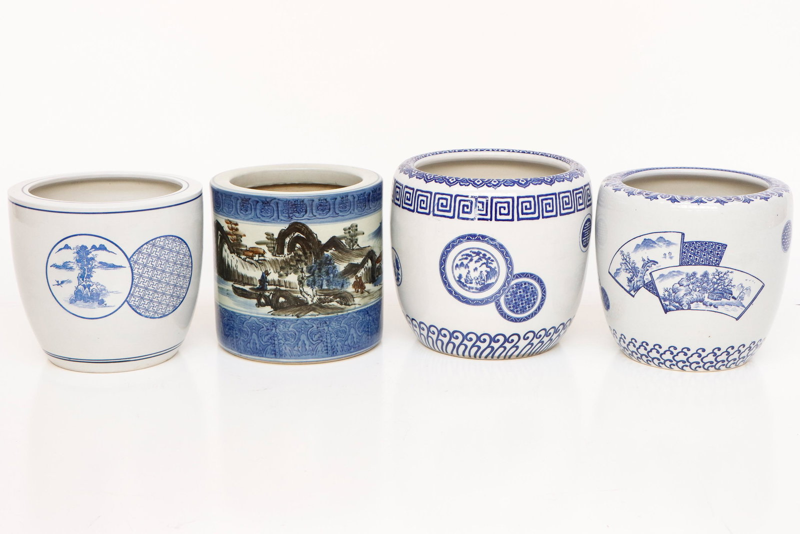 4 Japanese Blue & White Porcelain Hibachis: 4 Japanese Blue & White Porcelain Hibachis. Ranging in size from: 8.75'' x 9.75'' x 9.75'' (22 x 25 x 25 cm) to 9.75'' x 10.25'' x 10.25'' (25 x 26 x 26 cm). Provenance: Sylvia and Philip Chaplain Col