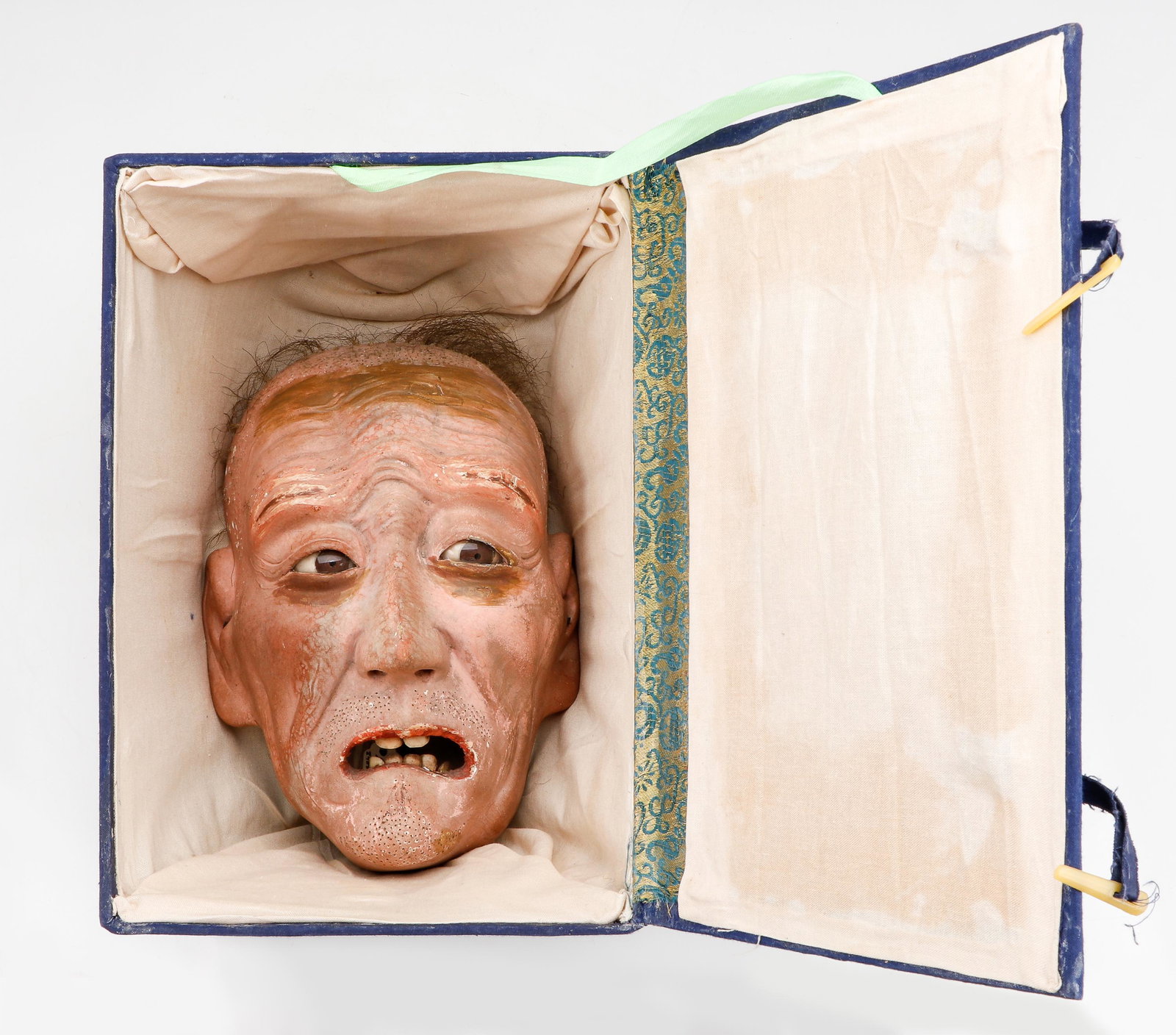 19th C. Japanese Hyper Realistic Iki Ningyo Mask: 19th C. Japanese Iki Ningyo Mask. Hyper realistic, with hair, glass eyes and carved bone teeth. Size: 8.5'' x 6'' x 4.5'' (22 x 15 x 11 cm). Provenance: Sylvia and Philip Chaplain Collection, New Hamp