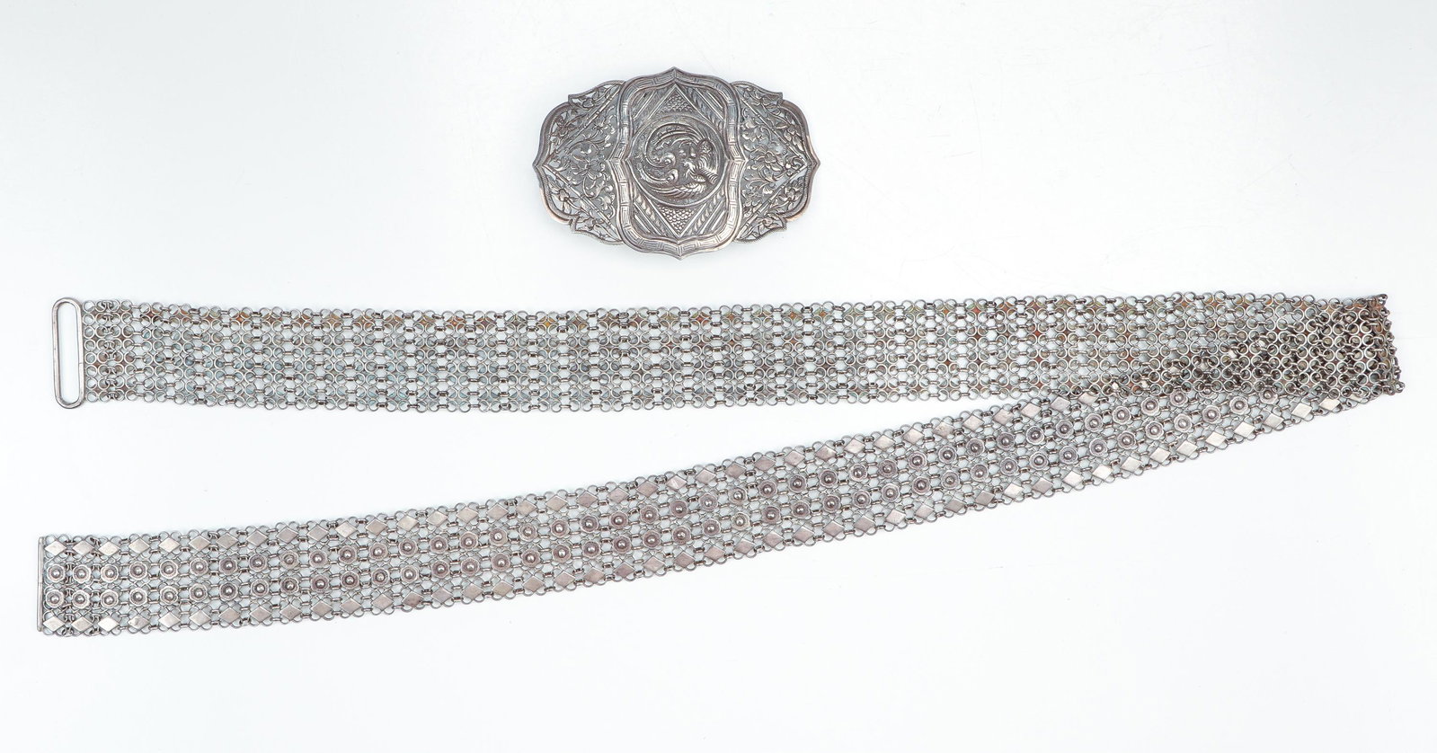 Malay Silver Belt and Buckle, C.1900: Malay Silver Belt and Buckle, C.1900. Size: Belt: 37" (94 cm); Buckle: 4'' x 2.5'' (10 x 6 cm). Provenance: Sylvia and Philip Chaplain Collection, New Hampshire.