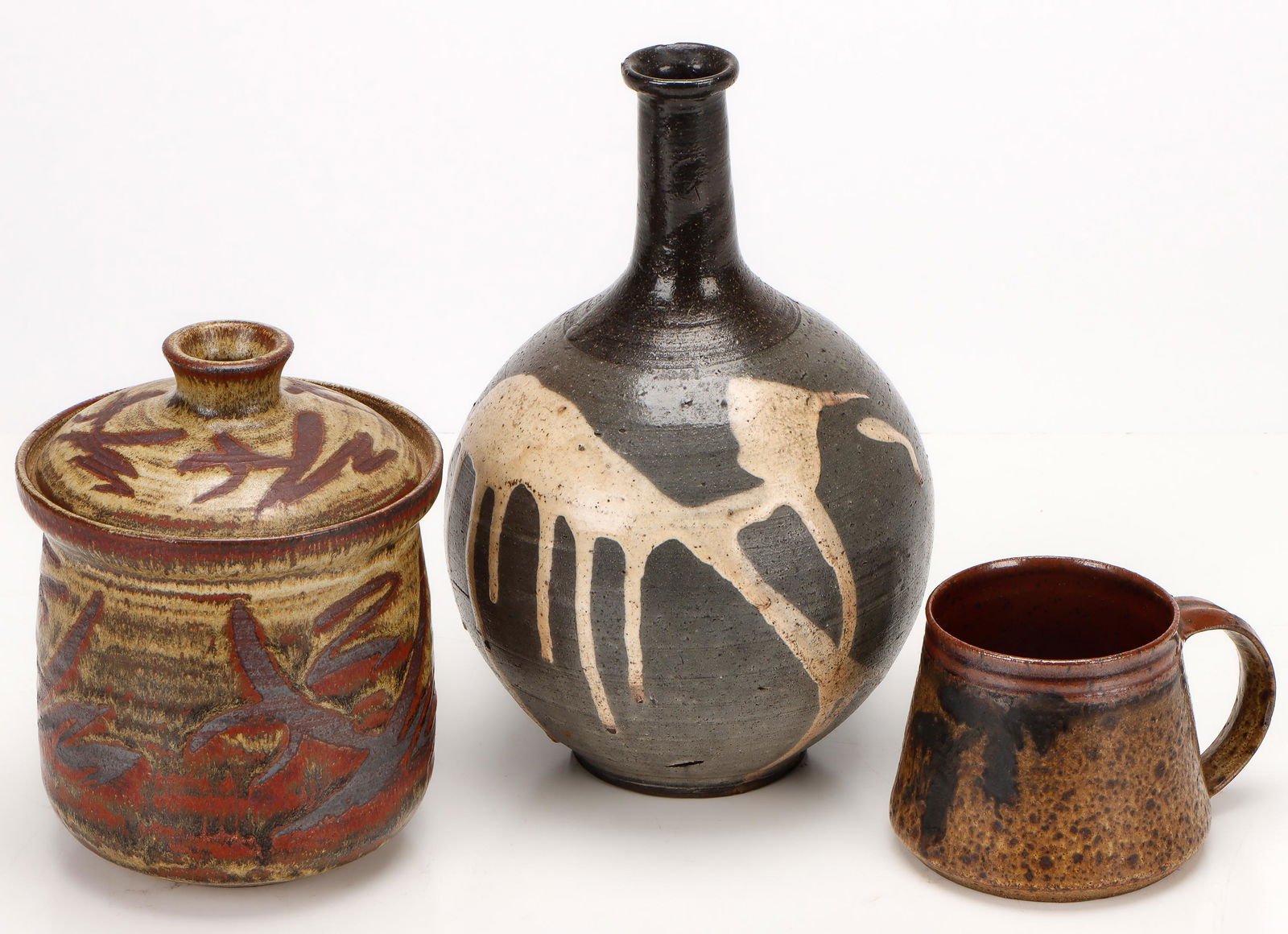 Art Pottery Group, Possibly St. Ives: Art Pottery Group, Possibly St. Ives. Including: a covered jar, a vase, and a cup attributed to Bernard Leach. Size: 1) 3'' x 5'' x 4'' (8 x 13 x 10 cm); 2) 6.5'' x 5'' x 5'' (17 x 13 x 13 cm); 3) 10'