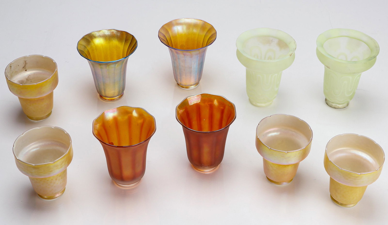 Quezal and Other Art Glass Lamp Shades: Quezal and Other Art Glass Lamp Shades. Size: Ranging from: 6.5'' x 5'' x 5'' (17 x 13 x 13 cm) to 5'' x 4'' x 4'' (13 x 10 x 10 cm). Provenance: Sylvia and Philip Chaplain Collection, New Hampshire.