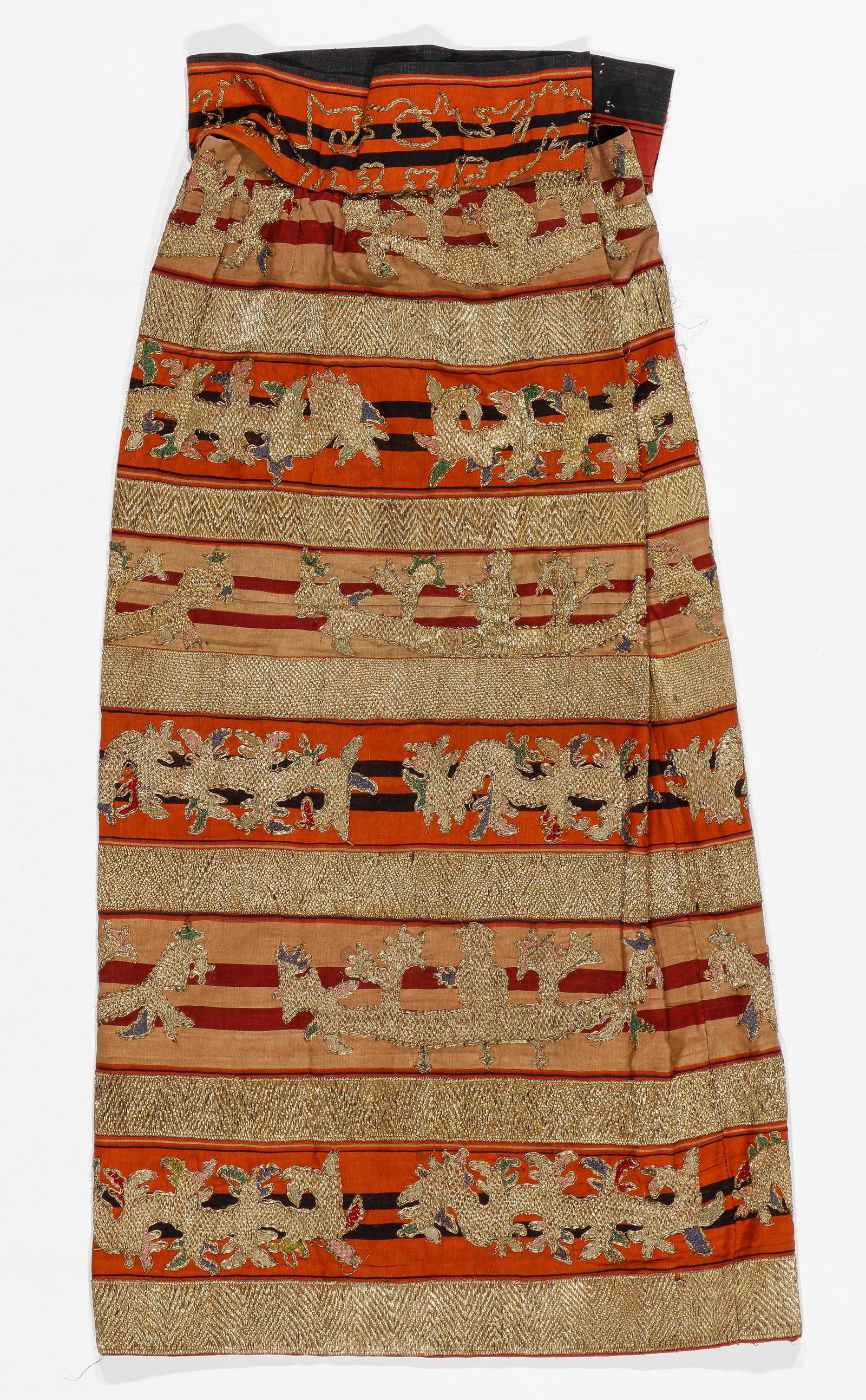 Antique Ceremonial "Tapis" Textile Skirt, Lampung, Indonesia: Antique woman's ceremonial tube skirt "tapis" textile with gold-wrapped couching and stumpwork cut and modified to include inner lining and waistband attached with hooks and snaps. Could be worn, appr