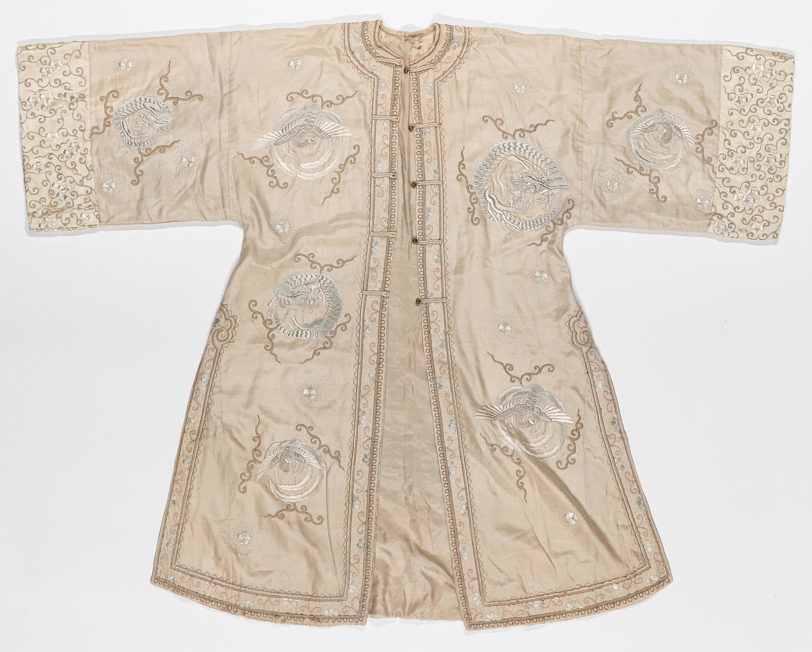 Beige Silk Robe: Beige Silk Robe With Beige Embroidery And Metallic Threadwork, Asia, Early 20th C. With phoenix and dragon motif and round metal buttons. Size: 3'8'' x 4'8'' (112 x 142 cm). Provenance: Sylvia and Phi