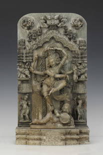 Indian stone carving of Shiva doing the Tandava: Indian stone carving of Shiva doing the Tandava, while surrounded by consorts and other Hindu Deities. Very detailed carving and in excellent condition. Size: 21'' x 11.25'' x 5'' (53 x 29 x 13 cm).