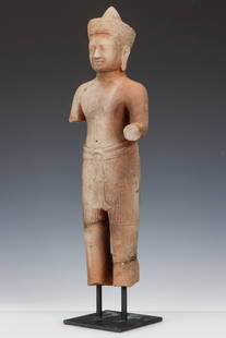 Khmer Carved Sandstone Male Deity, 12-13th C.: Khmer Carved Sandstone Male Deity, 12-13th C. On custom stand. Provenance: From a Virginia Collection. Size: 15.5'' x 5.5'' x 2.25'' (39 x 14 x 6 cm). Height on stand: 17.5" (44 cm)