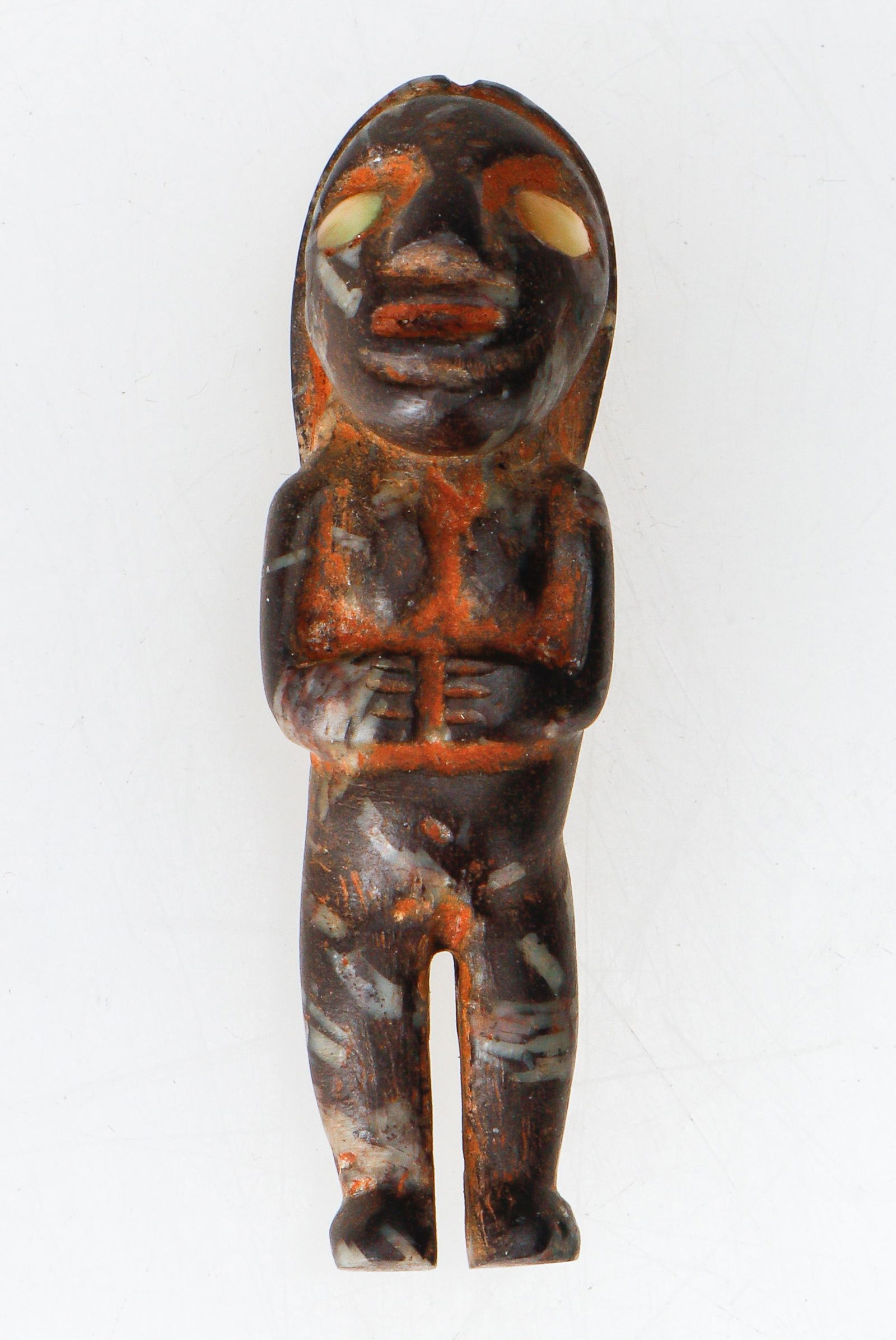 Chavin Pre-Columbian Delicate Anthropic Charm: Chavin Pre-Columbian Delicate Anthropic Charm. Dark blue lapis lazuli and shell eyes. Depicts a female with breasts and hands resting on her belly. Long hair flows down her back to the lower waist. A