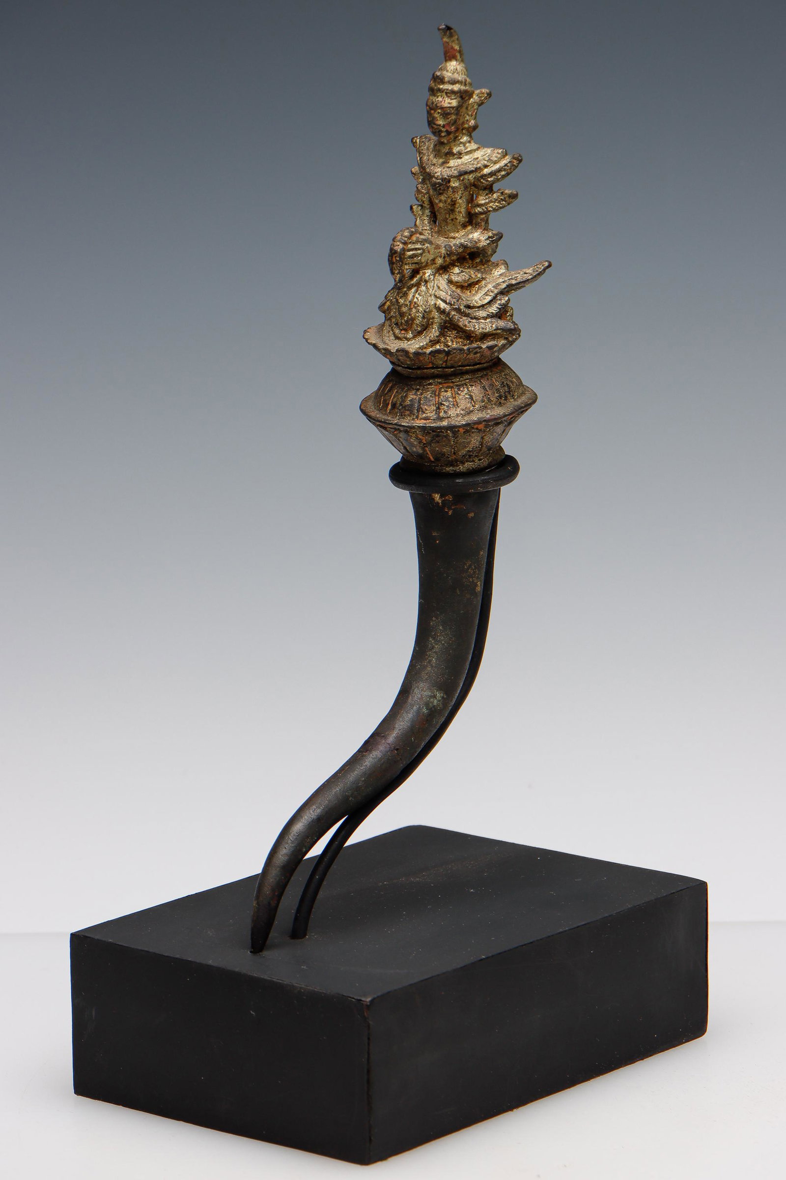 Antique Thai Gilt Bronze Attendant: Antique Thai Gilt Bronze Attendant, on stand. Provenance: Private New Jersey Estate; acquired from from Francois Villaret, UNDER the BO, in Changmai Thailand. Size: 10.5'' x 2.25'' x 5'' (27 x 6 x 13 