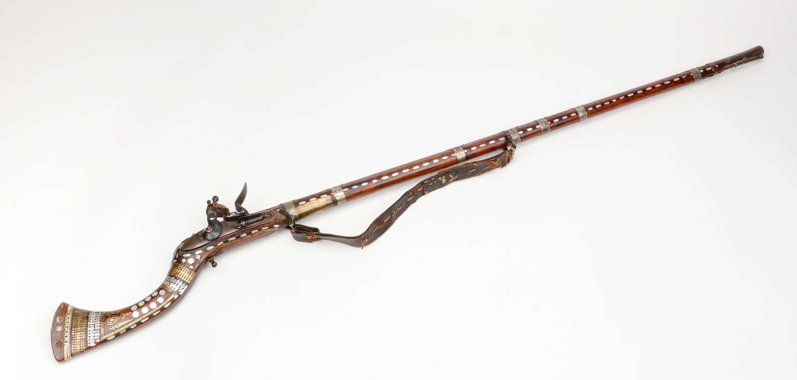 Antique North African Camel Gun, 18th/19th Century: Antique North African Camel Gun, 18th/19th Century. Flintlock with bone inlaid stock. Size: 62.5'' x 5'' x 3'' (159 x 13 x 8 cm). From the collection of Joseph Salamanca.