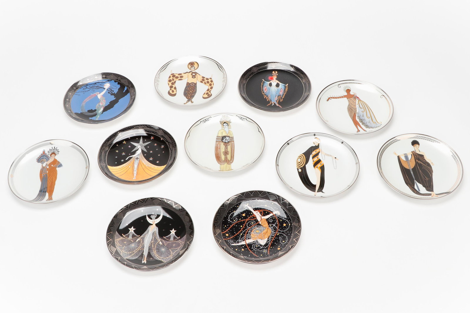 11 House of Erte Royal Doulton Plates: 11 House of Erte Royal Doulton Plates. Limited edition bone china plates with certificates of authenticity. Including: Plum Blossom, Willow Tree, Fireflies, Athena, Glamour, Queen of the Night, New Yo