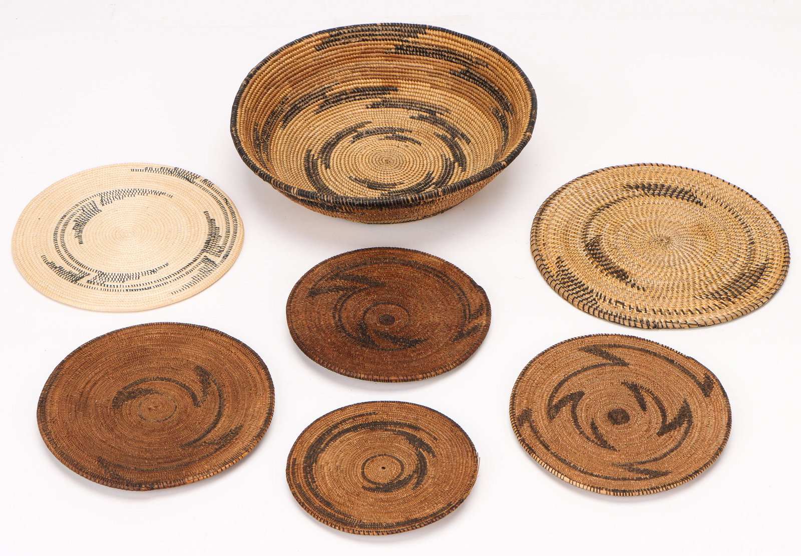 Collection of African Tutsi Prestige Trays and Discs, Rwanda, Early & Mid 20th C.: Collection of African Tutsi Prestige Trays and Discs, Rwanda/Tutsi, Early 20th C. and Later. Size: Diameters ranging from 4.5'' (11 cm) to 8.5" (22 cm).