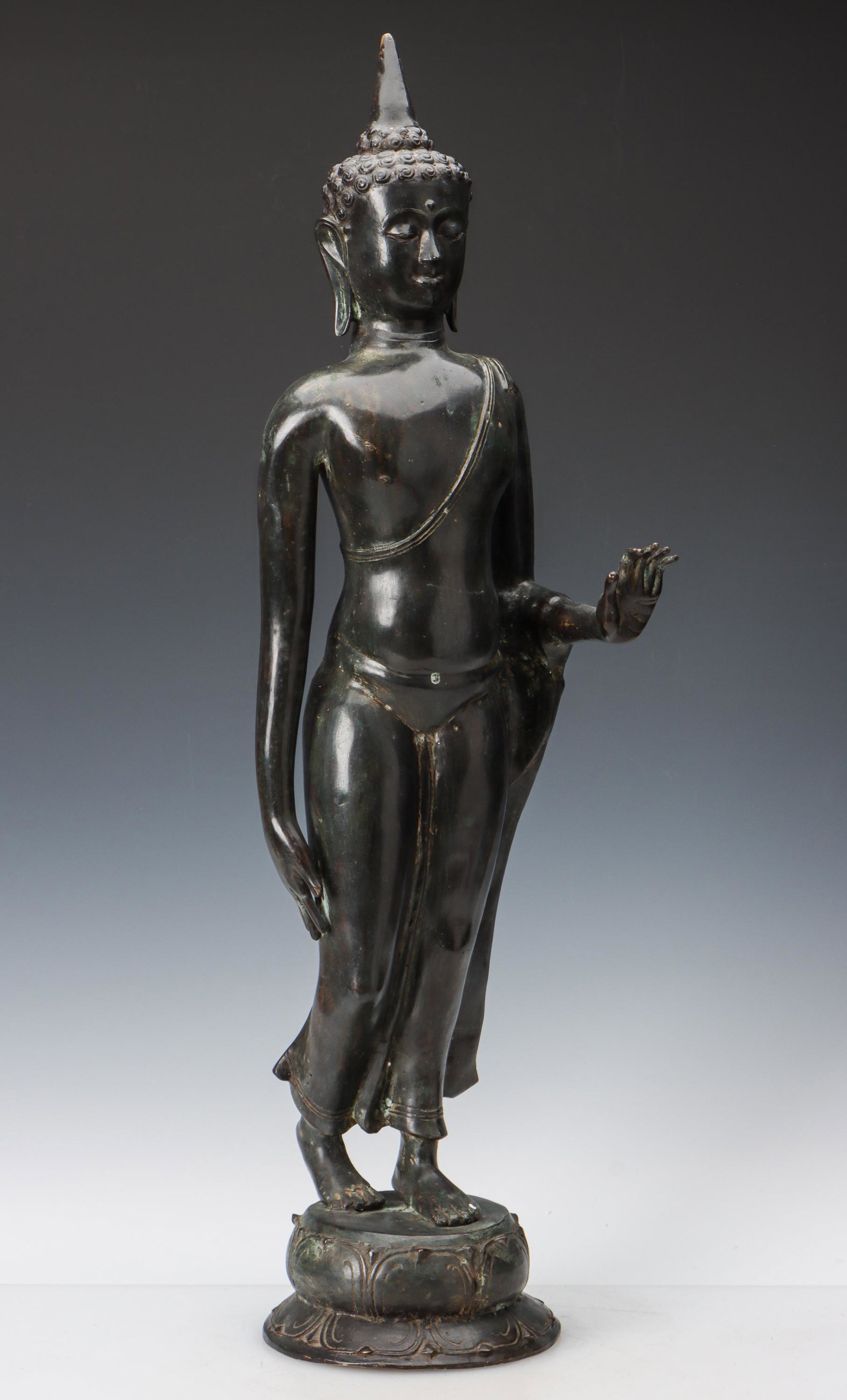 Southeast Asian Patinated Copper Alloy Standing Buddha: Southeast Asian Patinated Copper Alloy Standing Buddha. Size: 30'' x 8'' x 9'' (76 x 20 x 23 cm).