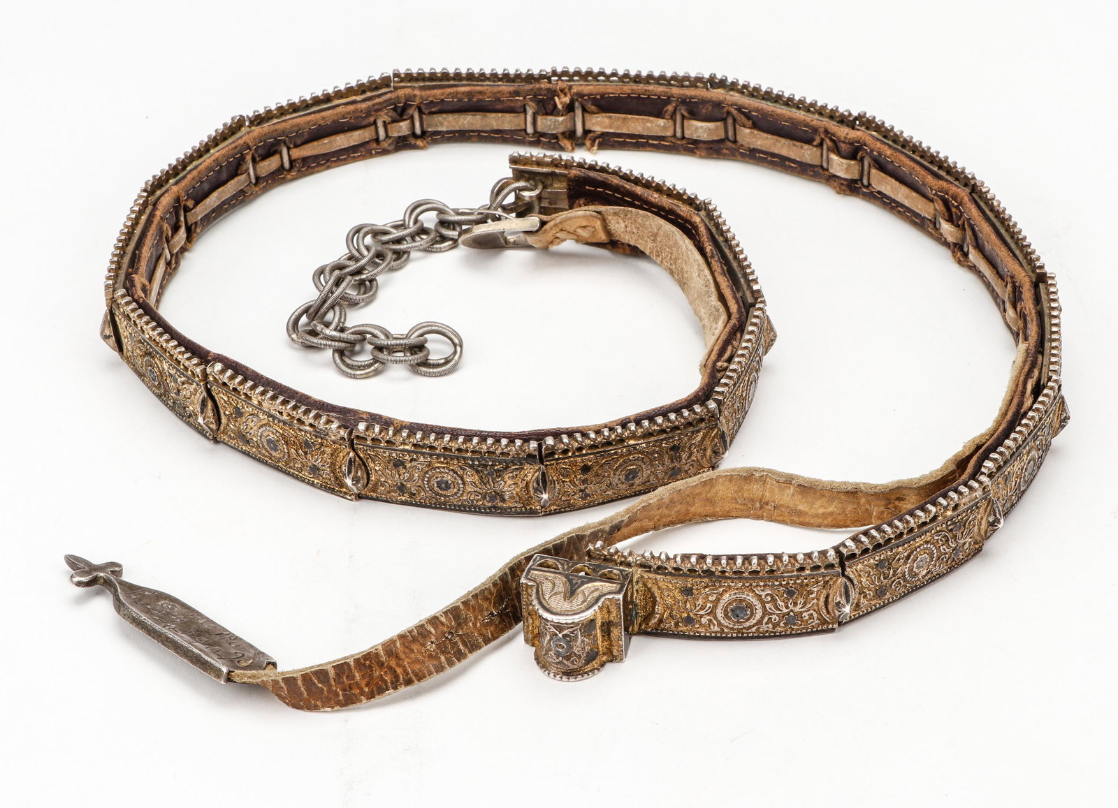 Armenian Silver Belt, Niello with Gold Wash, 19th C.: Armenian Silver Belt, Niello with Gold Wash, 19th C. On leather. One silver element inscribed in Armenian. Size: 31'' x 1'' (79 x 3 cm).