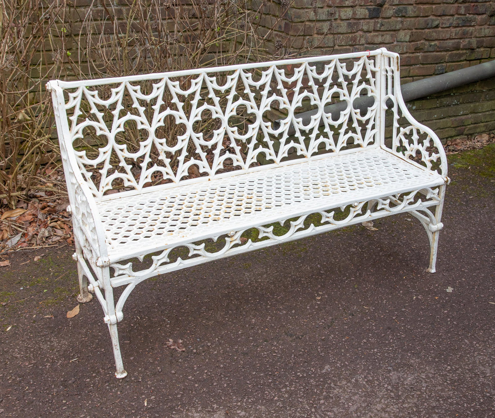 Gothic White Painted Cast Iron Garden Bench: Gothic White Painted Cast Iron Garden Bench. Size: 34'' x 56'' x 22'' (86 x 142 x 56 cm). Exhibition and Post-Auction Pickup Location: Oakwell Estate, 1835 County Line Rd., Villanova, PA, 19085.
