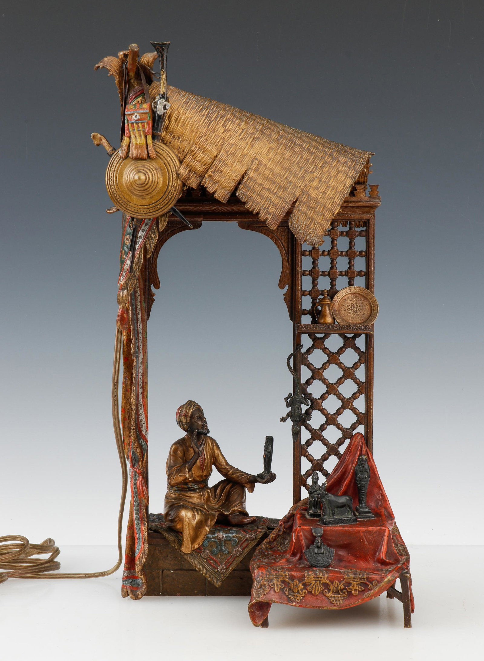 Antique Austrian Cold-Painted Bronze by Franz Bergman, "The Merchant": Antique Austrian Cold-Painted Bronze by Franz Bergman. "The Merchant" early 20th C. Cast in the form of a seated merchant with Egyptian antiquities, stamped with Bergman amphora foundry seal and gesch