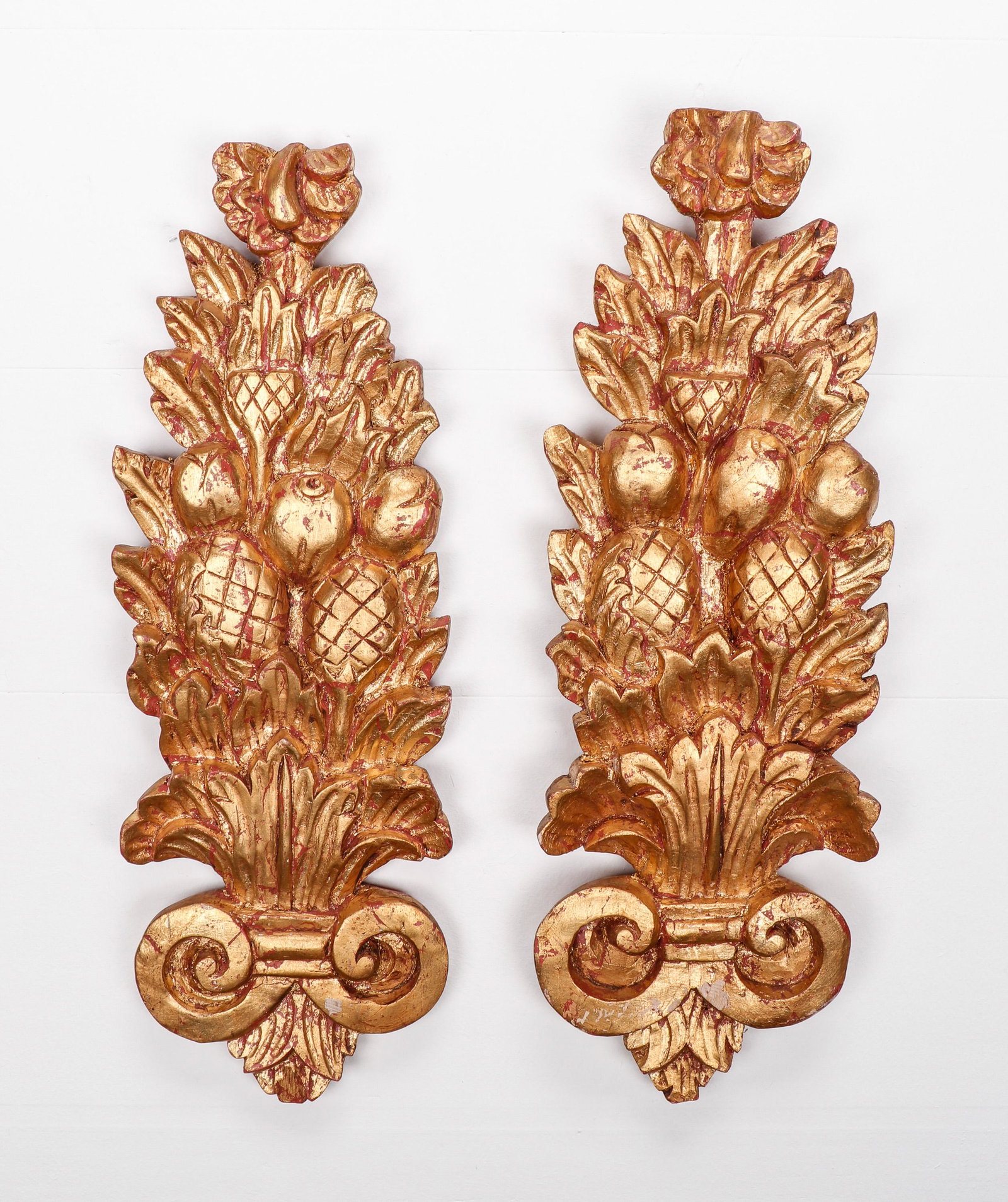 Pair of Giltwood Wall Ornaments: Pair of Giltwood Wall Ornaments. Fruit and Leaf designs. Size: 24'' x 8'' x 2'' (61 x 20 x 5 cm). Exhibition and Post-Auction Pickup Location: Material Culture, 4700 Wissahickon Ave., Philadelphia PA,